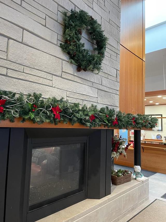 Wreath and garland above a modern fireplace