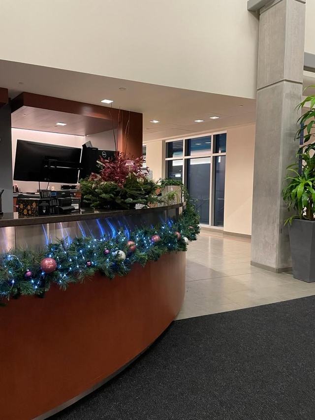 Garland with blue baubles along a curved reception counter