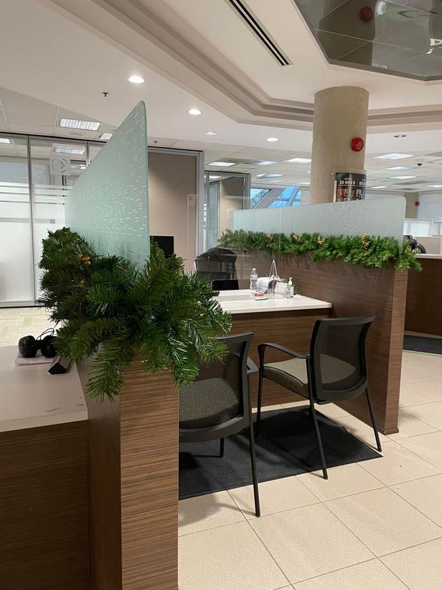Fresh green garland along a reception counter and pillar
