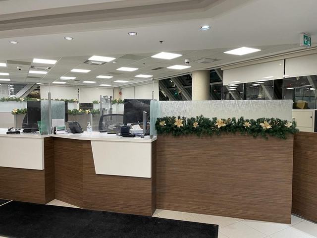Garland with gold stars along a reception counter