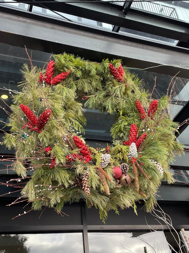 Natural pine Christmas wreath with red decorations